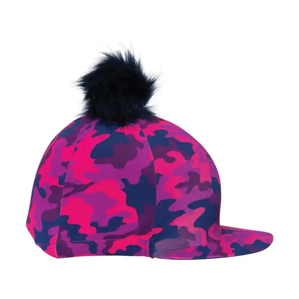A vibrant pink and navy camouflage dynaforce hat cover with black faux fur pom pom for equestrian use