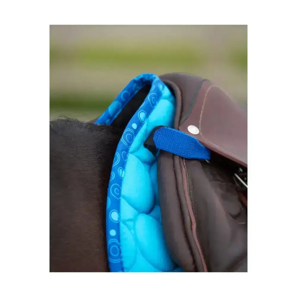 Bright blue quilted close contact saddle pad with circular pattern from Hy Equestrian dynamizs ecliptic line