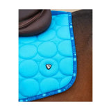 Bright blue quilted Hy Equestrian dynamizs ecliptic close contact saddle pad with circular padding and decorative border