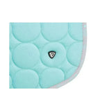 A mint green quilted equestrian dynamizs ecliptic close contact saddle pad with subtle edge pattern and black logo