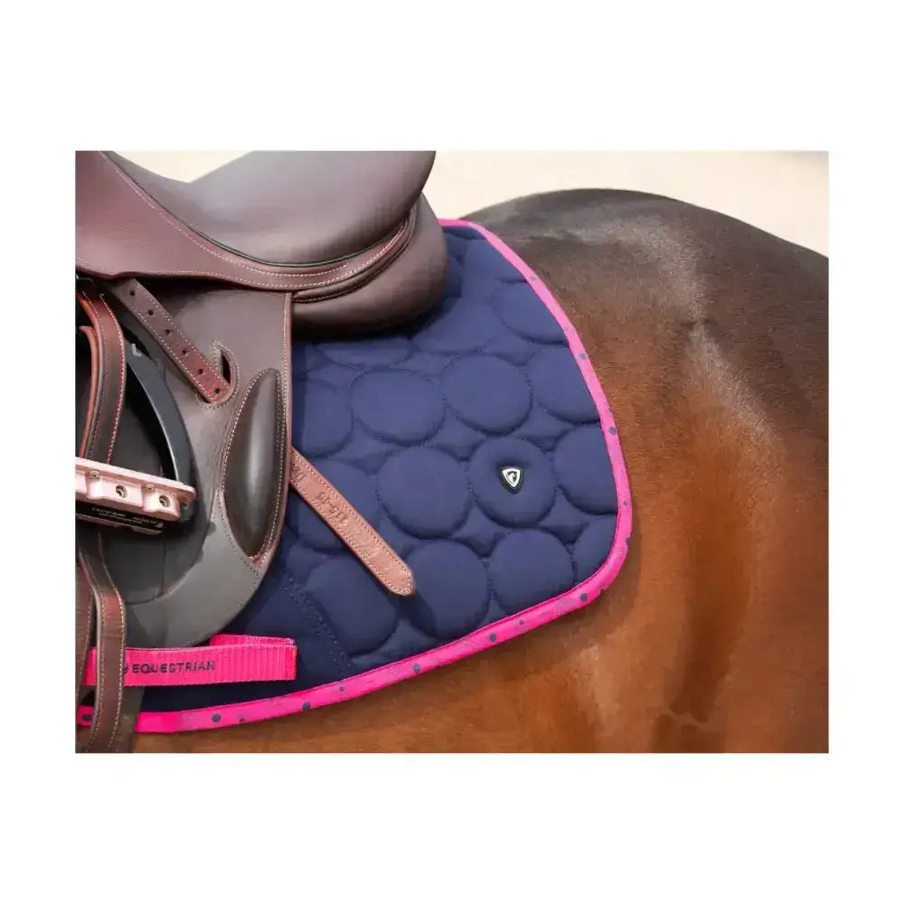 Navy blue quilted hy equestrian dynamizs ecliptic close contact saddle pad with pink trim and subtle dot pattern