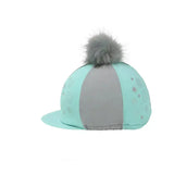 A mint green and gray equestrian dynamizs ecliptic hat cover with a fluffy gray pom-pom on top