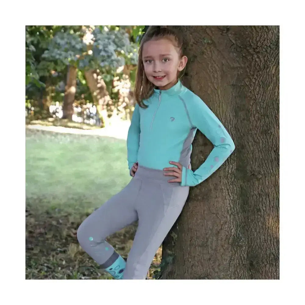 Light blue and gray equestrian dynamizs ecliptic riding tights with subtle patterned accents for performance riding