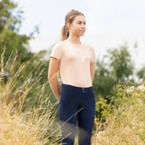 A pair of navy blue fitted riding pants with button closures matching the equestrian elevate allure mizs t-shirt collection