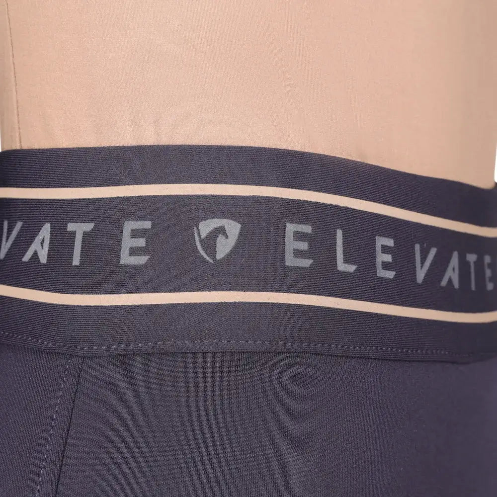 Navy blue elastic waistband with white trim and silver elevate branding on hy equestrian elevate allure riding tights