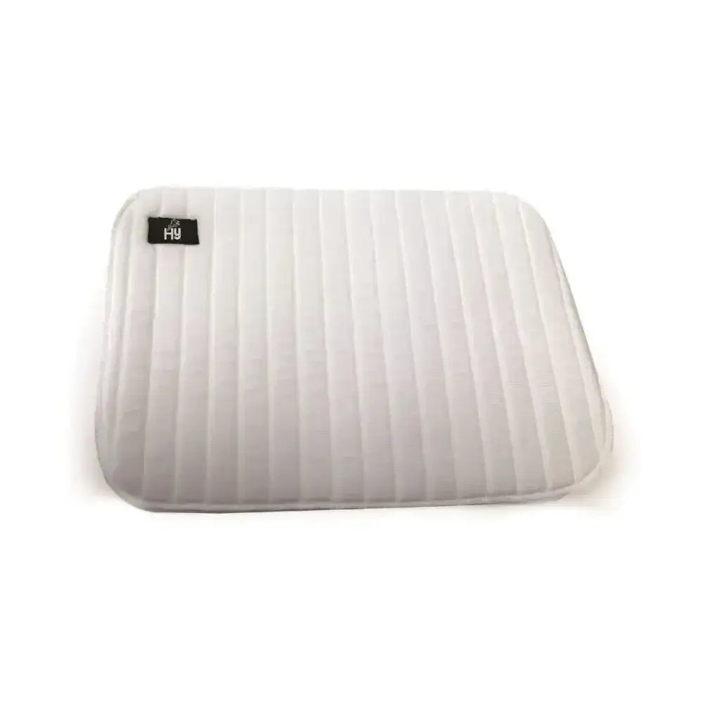 White quilted foam leg pads with vertical stitching and a black label offer extra protection for equestrian use