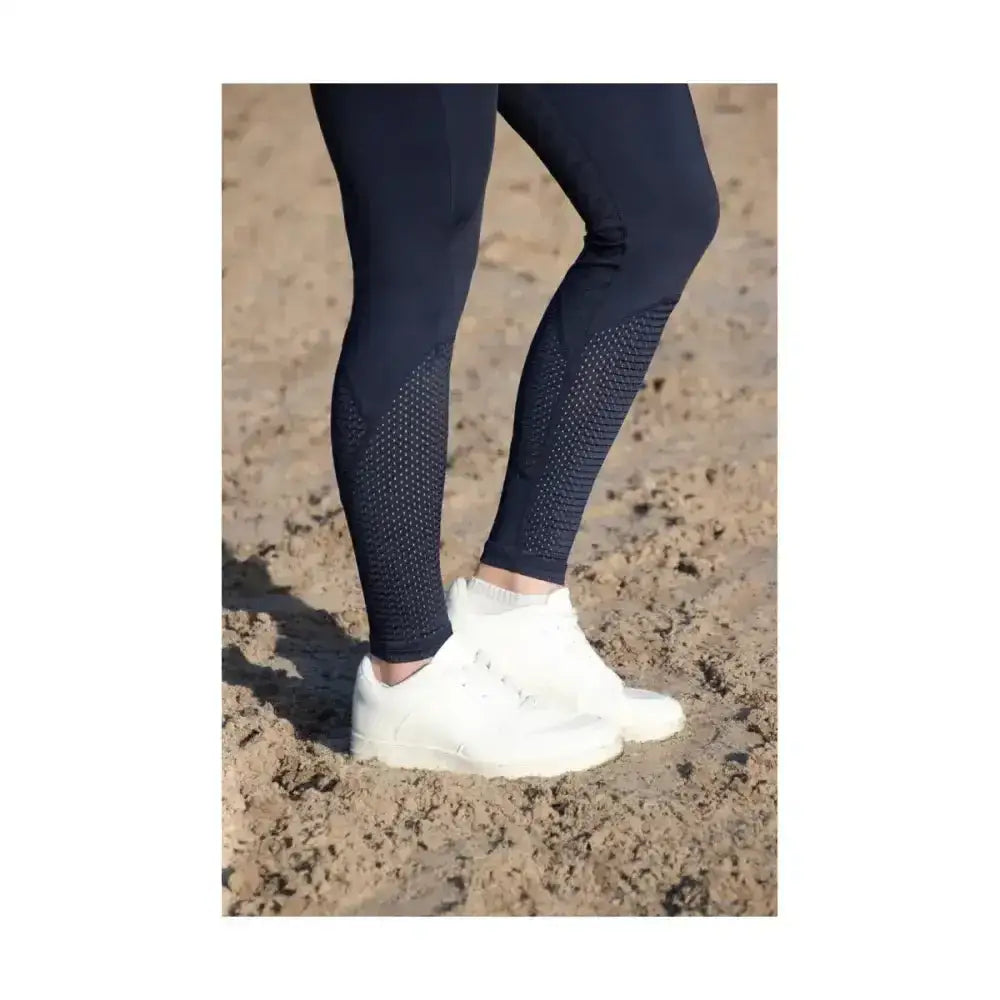 Navy blue fordwich riding tights with textured perforated sides made from four-way stretch fabric for equestrian use