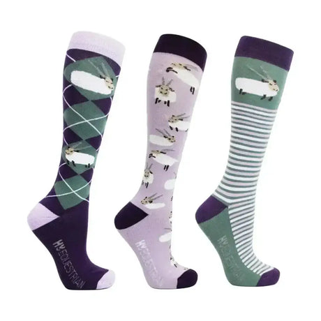 Three pairs of hy equestrian gallant goat socks in purple lavender and green with fun sheep designs and argyle patterns