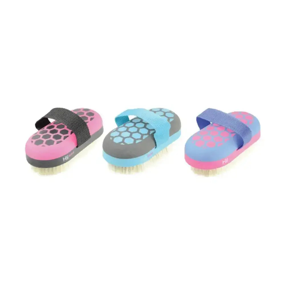 Three colorful hy equestrian glitter body brushes with soft goat hair bristles and hexagonal patterns in pink gray blue designs