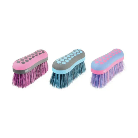 Three colorful equestrian glitter dandy flick brushes with soft bristles and ergonomic pink blue and purple handles