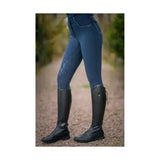 Dark blue highgrove ladies breeches with reflective panels and studded back pocket paired with black leather boots