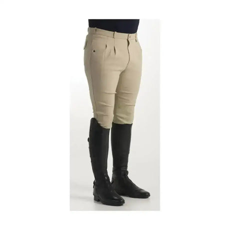 Beige equestrian jakata men’s breeches with tailored fit pleated front and stretch leather knee paired with black boots