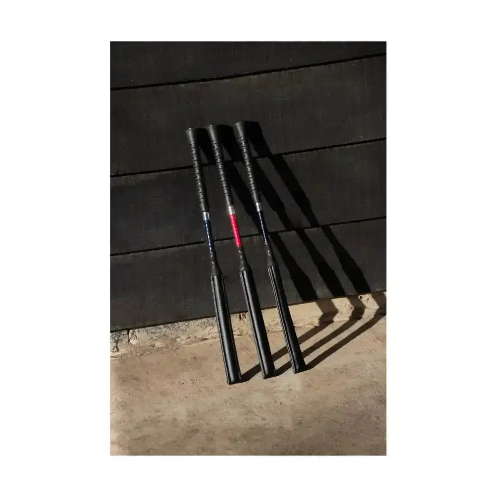 Three black hy equestrian legal jump bats with textured grips and colored accents for competitive jumping use