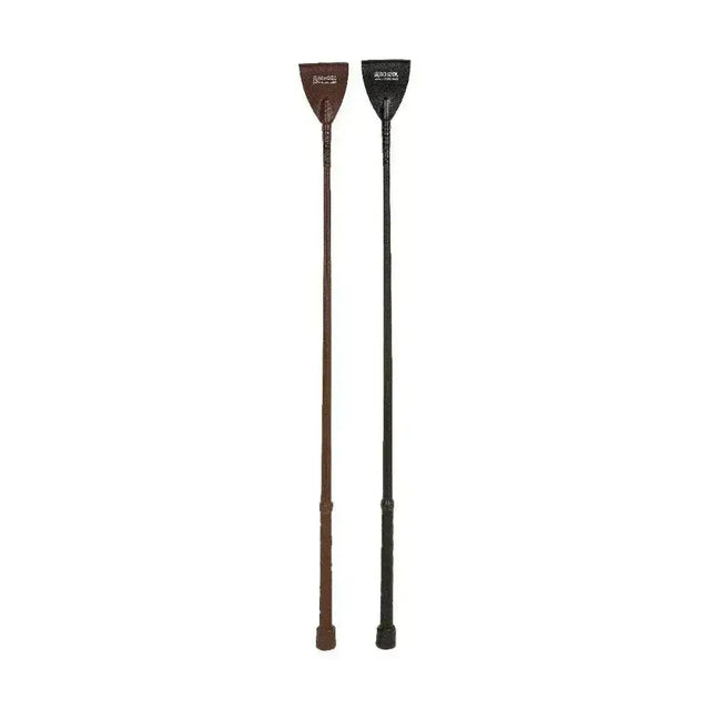 Two equestrian luxury leather whips in brown and black with textured grip and embossed branding on handles
