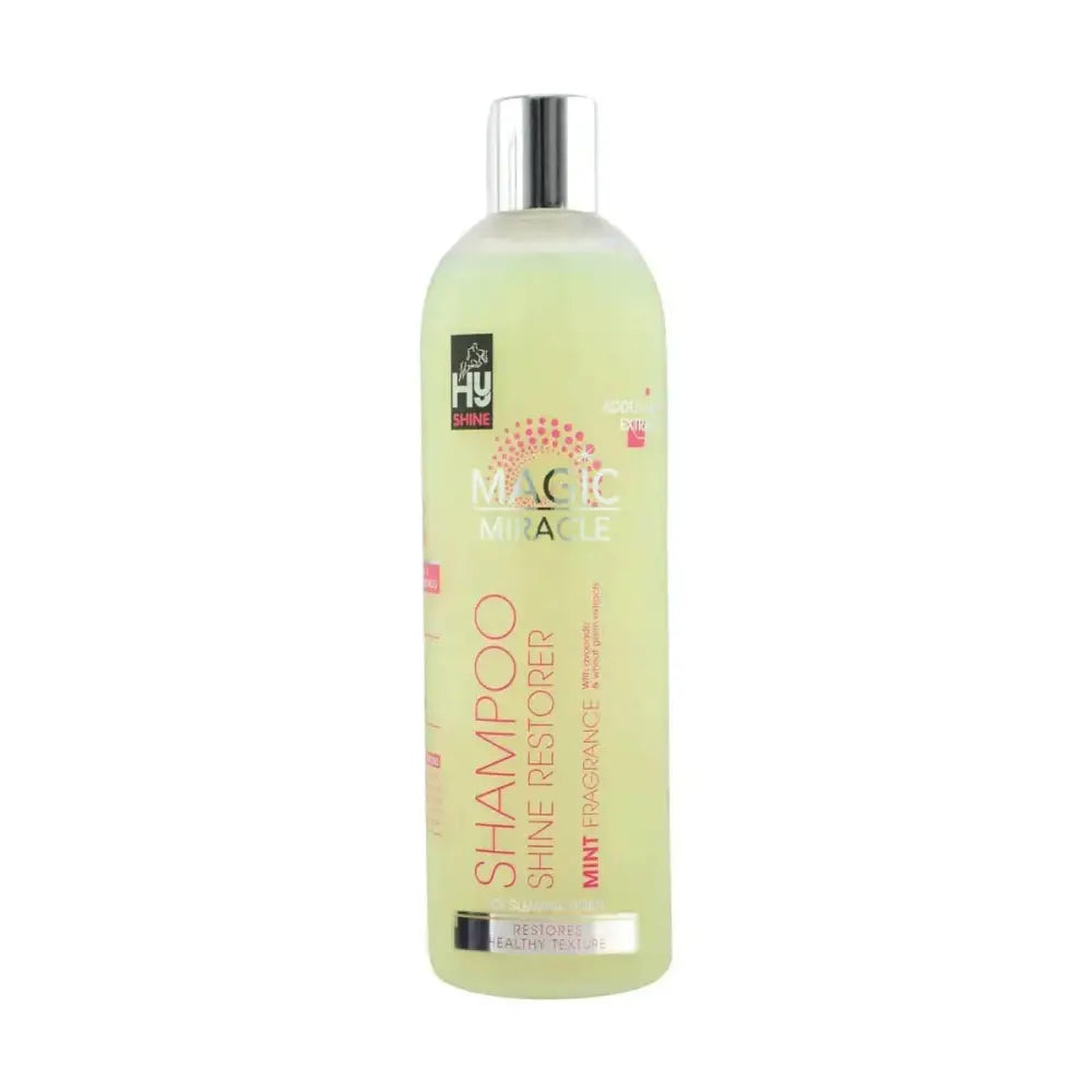 A translucent pale green bottle of hy equestrian magic miracle shampoo with silver cap and shine restorer mint fragrance label