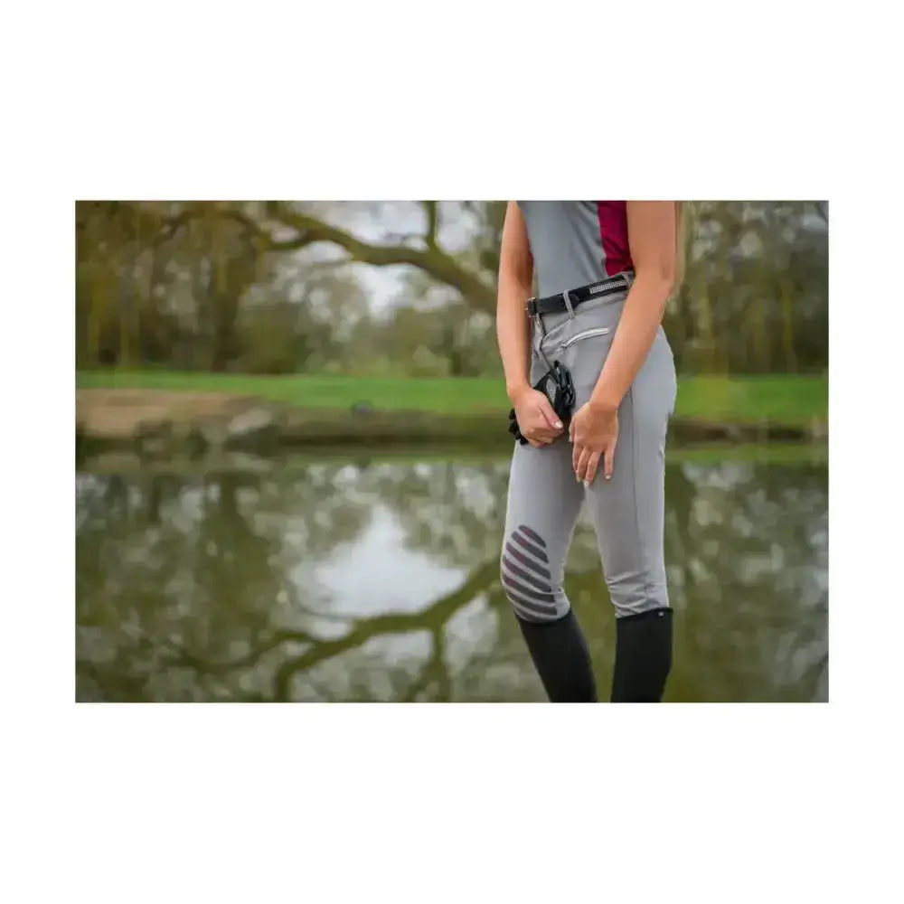 Gray equestrian mizs arabella breeches with black knee patches and subtle white side stripe for riding comfort