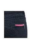 Back view of black denim hy equestrian mizs passion breeches with a vibrant pink zipper on the riding breeches pocket