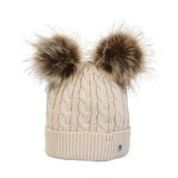 Cream-colored cable-knit equestrian morzine children’s bobble hat with two fluffy brown faux fur pom-poms
