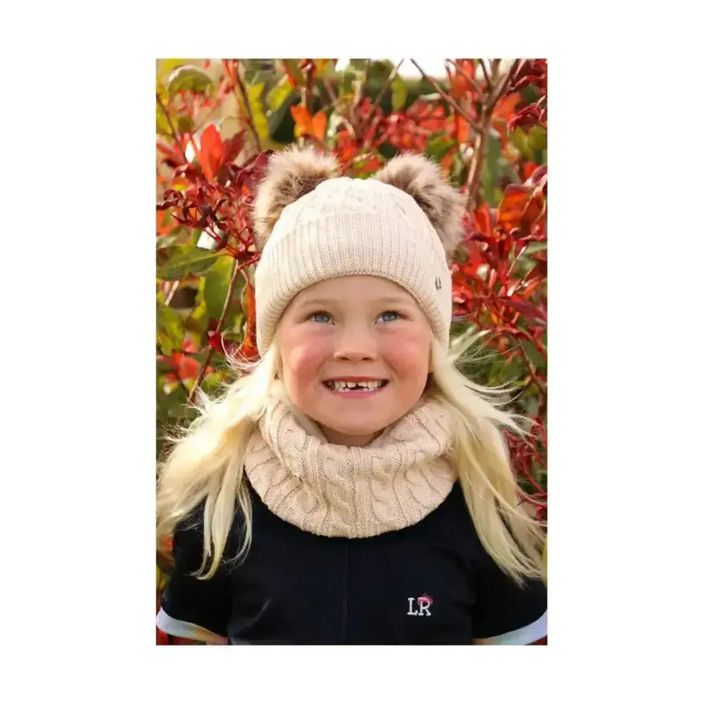 Cream-colored knitted hy equestrian morzine children’s bobble hat with fluffy faux fur ears for kids