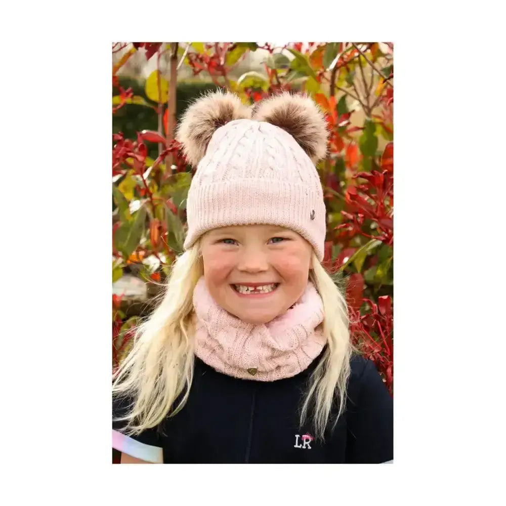 Pink knitted Hy Equestrian Morzine children’s bobble hat with two fluffy brown pom-poms for kids winter wear