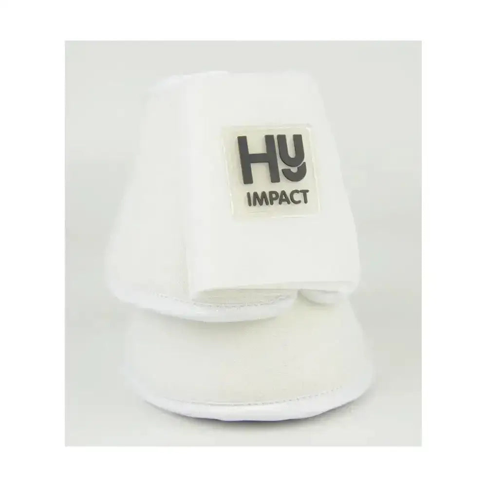 White plush horse hoof bootie with black hy impact logo patch featuring recessed stitching in equestrian neoprene reach boots