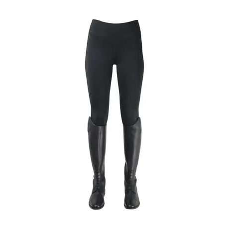 Black oslo softshell riding tights with brushed fleece lining paired with black leather boots for riding use