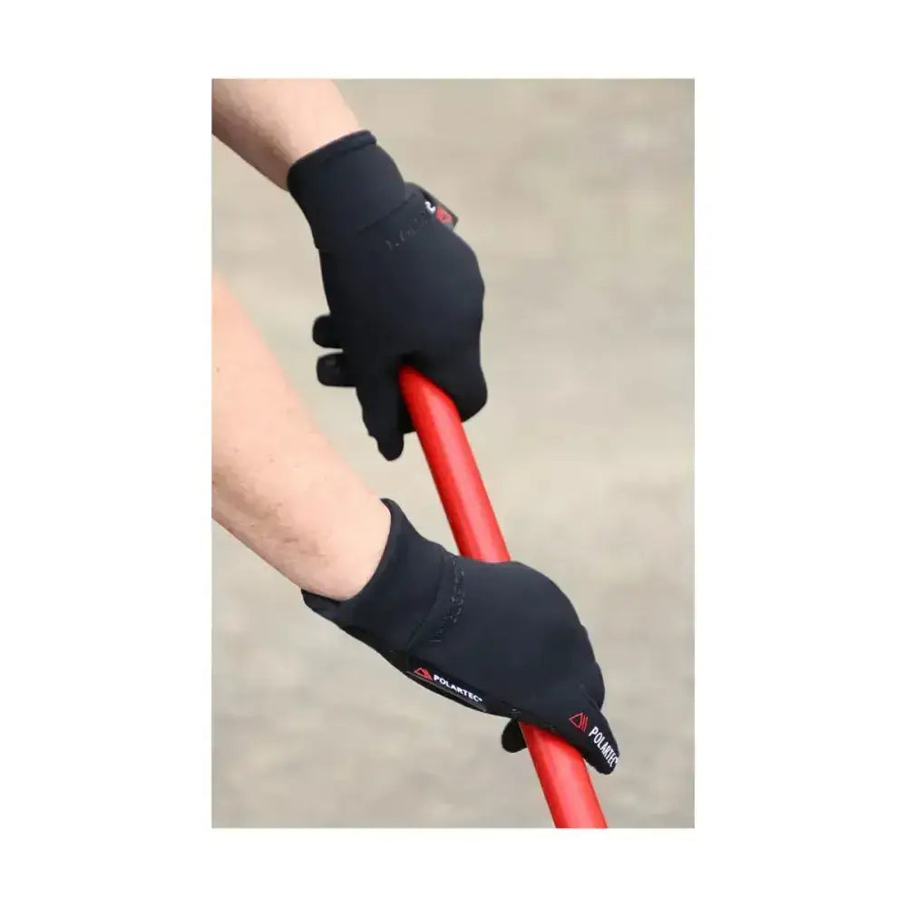 Black Hy Equestrian polartec glacial riding gloves with reinforced palms and wrist straps gripping a red handle