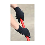 Black Hy Equestrian polartec glacial riding gloves with reinforced palms and wrist straps gripping a red handle