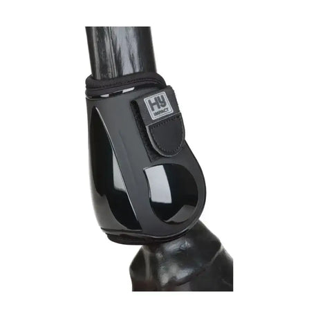 Black glossy plastic hy equestrian pro fetlock boots with black fabric strap and hy impact logo patch for quality performance boots