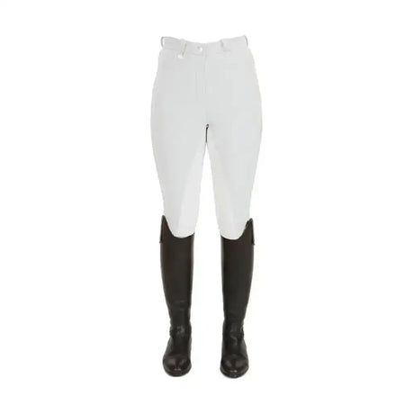 White equestrian pro ladies breeches with black leather boots designed for competitive rider comfort and style