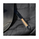 Black leather strap with woven gold accent on rosciano rose gold stirrup leather from hy equestrian