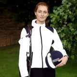 White and navy equestrian helmet with black trim paired with hy equestrian silva flash reflective jacket