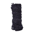 Black woven slow flow haynet rope tightly coiled and secured with braided cord for equestrian slow flow and slow hay consumption