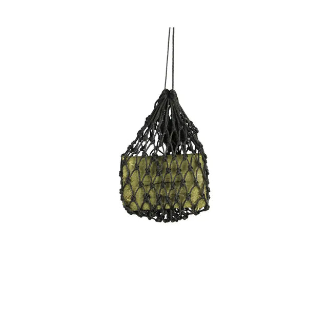 Black macrame slow flow snack haynet holding green glass forage block for equestrian slow flow feeding