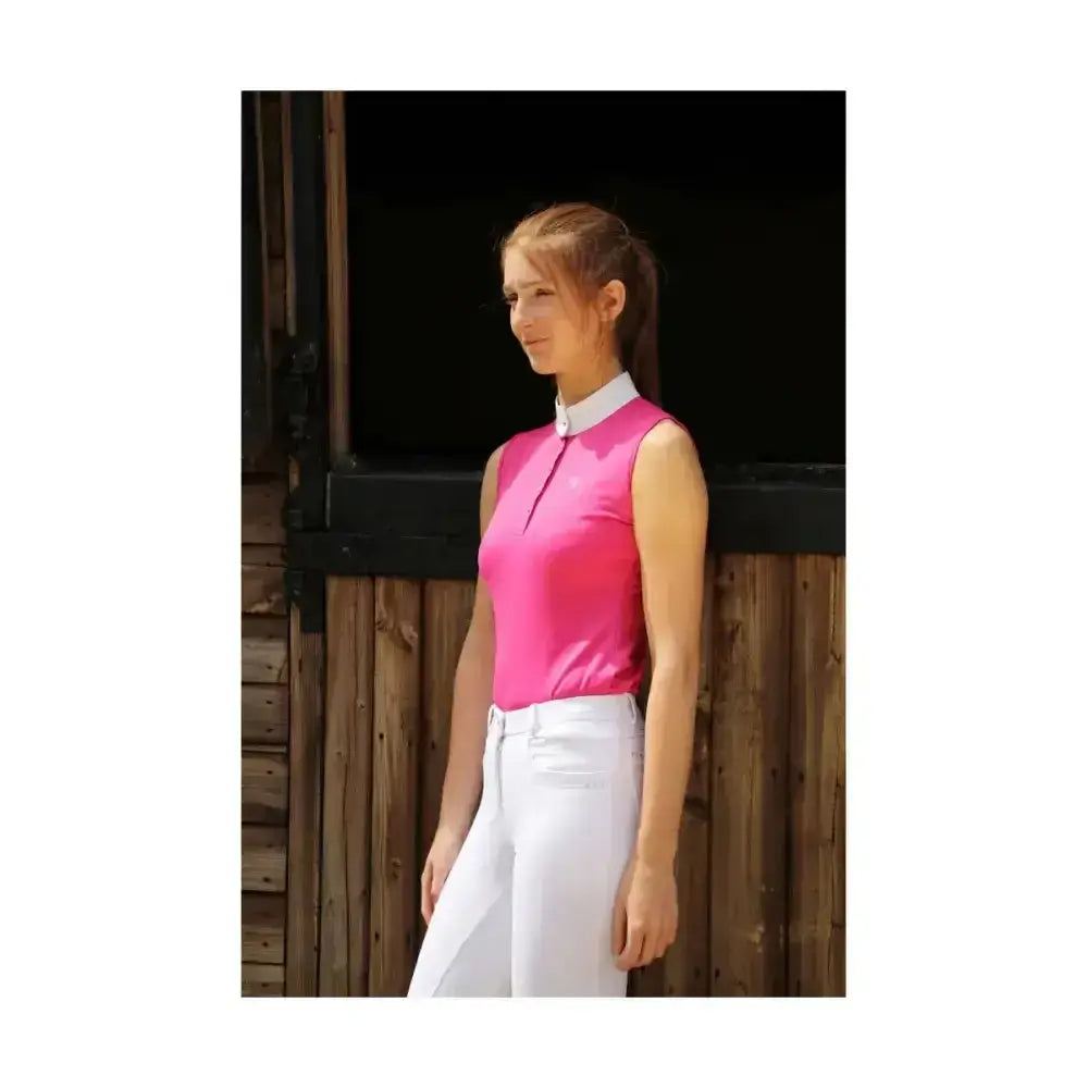 A vibrant pink hy equestrian sophia sleeveless show shirt with crystal press studs and silk trim detailing
