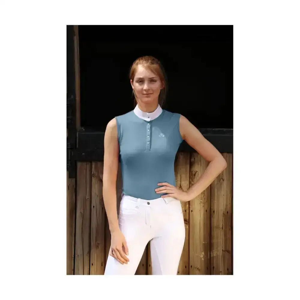 A light blue hy equestrian sophia sleeveless top with white collar silk trim detailing and five crystal press buttons