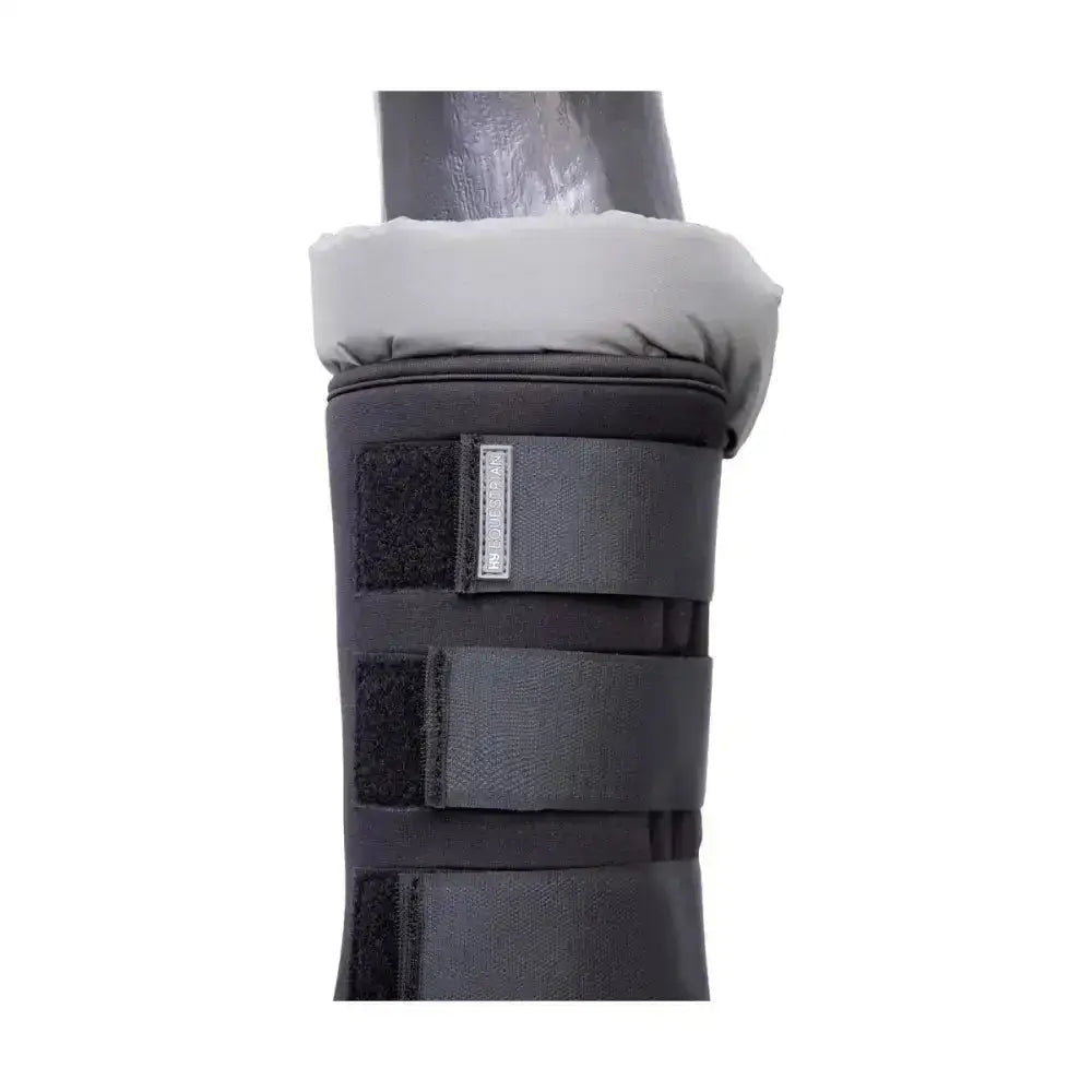 Black padded hy equestrian stable protection boot with gray fleece lining and adjustable velcro straps to wick moisture