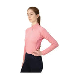 A soft pink long-sleeved athletic top with high collar and zipper front in hy equestrian synergy base layer for equestrian athlete