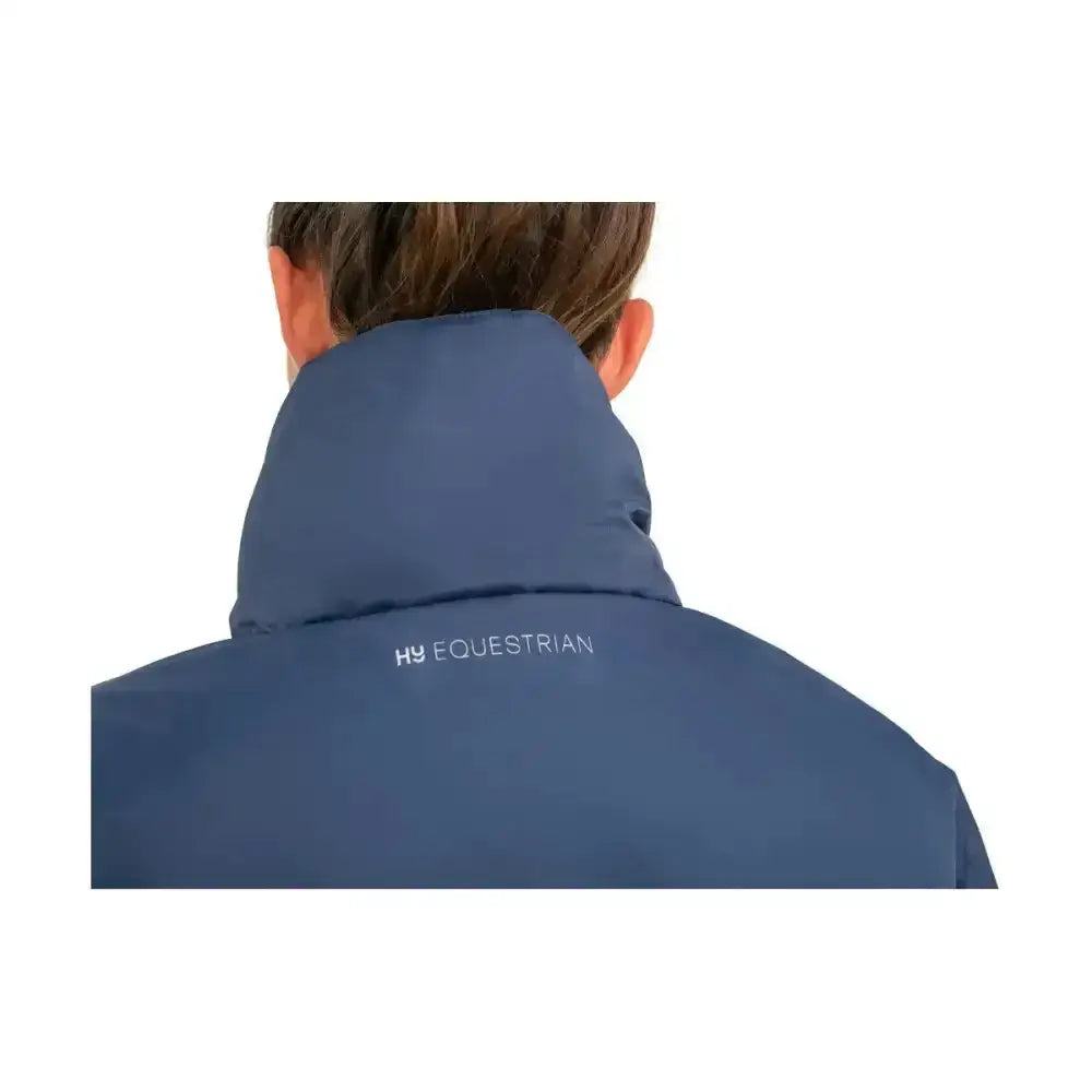 Navy blue equestrian synergy blouson vest with high collar and hy equestrian logo on back featuring fully taped seams