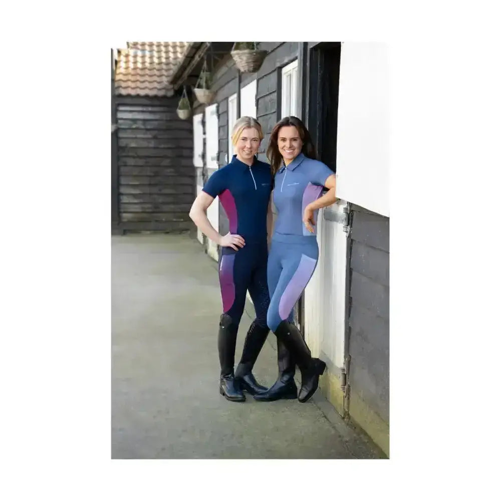 Women wearing navy and purple gradient synergy elevate polo riding suits with specialised moisture wicking fabric