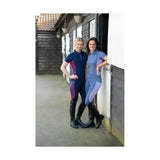 Women wearing navy and purple gradient synergy elevate polo riding suits with specialised moisture wicking fabric