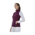 A maroon hy equestrian synergy flex gilet with white zipper accents and 4-way stretch soft fabric for comfort