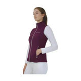 A maroon hy equestrian synergy flex gilet with white zipper accents and 4-way stretch soft fabric for comfort