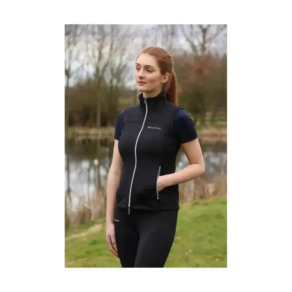 Black hy equestrian synergy flex gilet with white zipper, side pockets, high collar, and 4-way stretch soft fabric