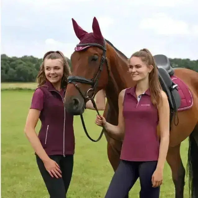Maroon horse ear cover with mesh and elastic band shown with hy equestrian synergy sleeveless polo sleeveless polo features