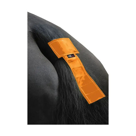 Bright orange reflective equestrian tail band with black hu logo label designed as a tail guard for horse safety