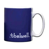 A navy blue ceramic mug with white handle and thelwell collection mugs text from hy equestrian thelwell collection