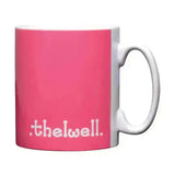 A vibrant pink ceramic mug with white handle and the well text from the equestrian thelwell collection mugs