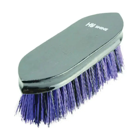 A sleek black handled wooden dandy brush with vibrant purple mixed pp bristles branded hu shine for equestrian use