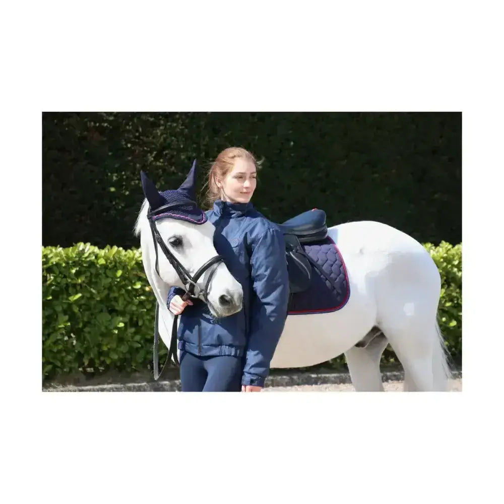 Navy blue quilted horse saddle pad with purple trim paired with hy signature fly veil crocheted fly veil for horses